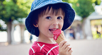 Young boy eating ice cream